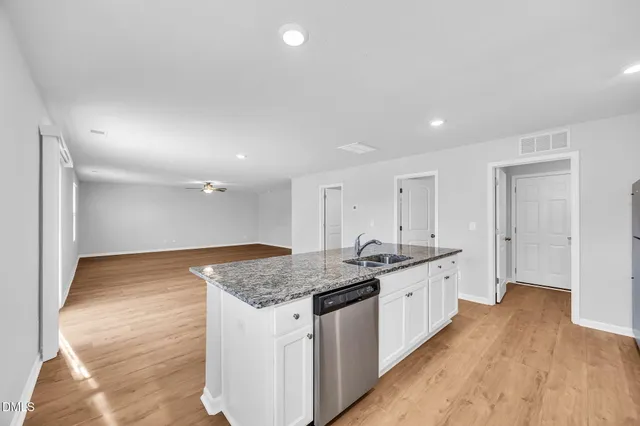 a bathroom with a sink a mirror and a toilet