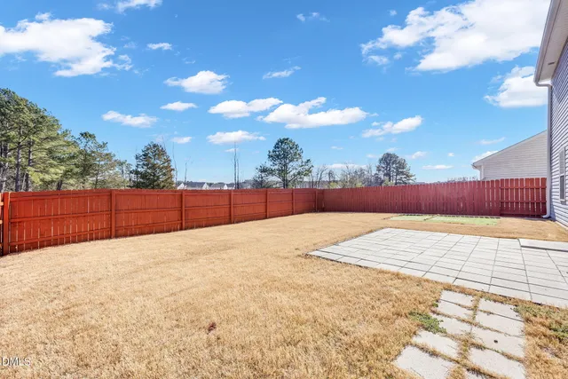 a kitchen with granite countertop a sink and a stove top oven