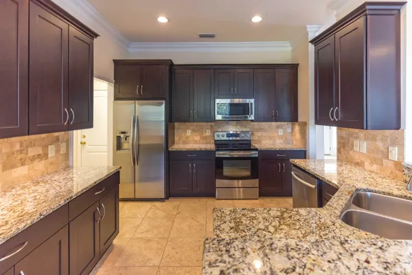 a kitchen with granite countertop a sink and a granite counter top