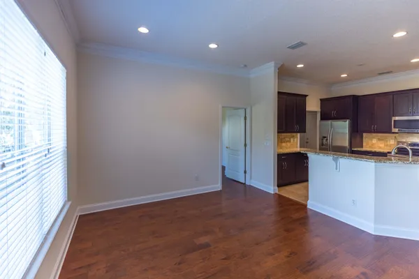 a kitchen with a refrigerator and cabinets