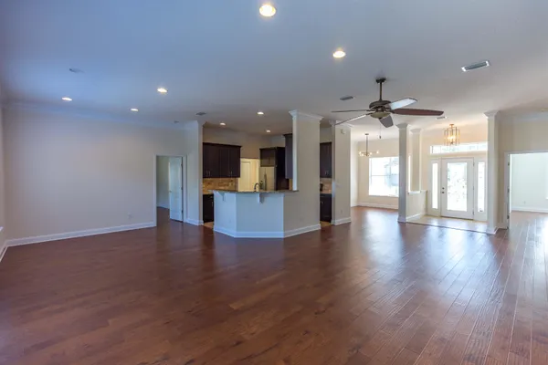 a kitchen with granite countertop wood cabinets and a stove top oven