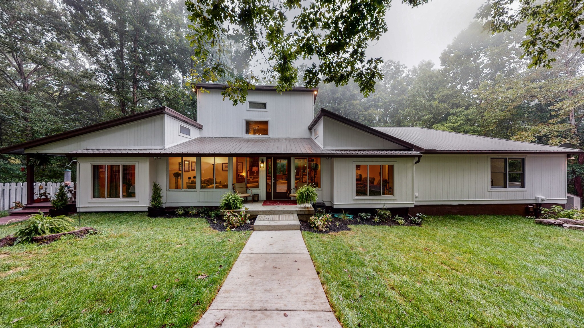 7449 Les Hughes Road Fairview, TN 37062 - Photo 1 of 49 a front view of a house with a yard and trees