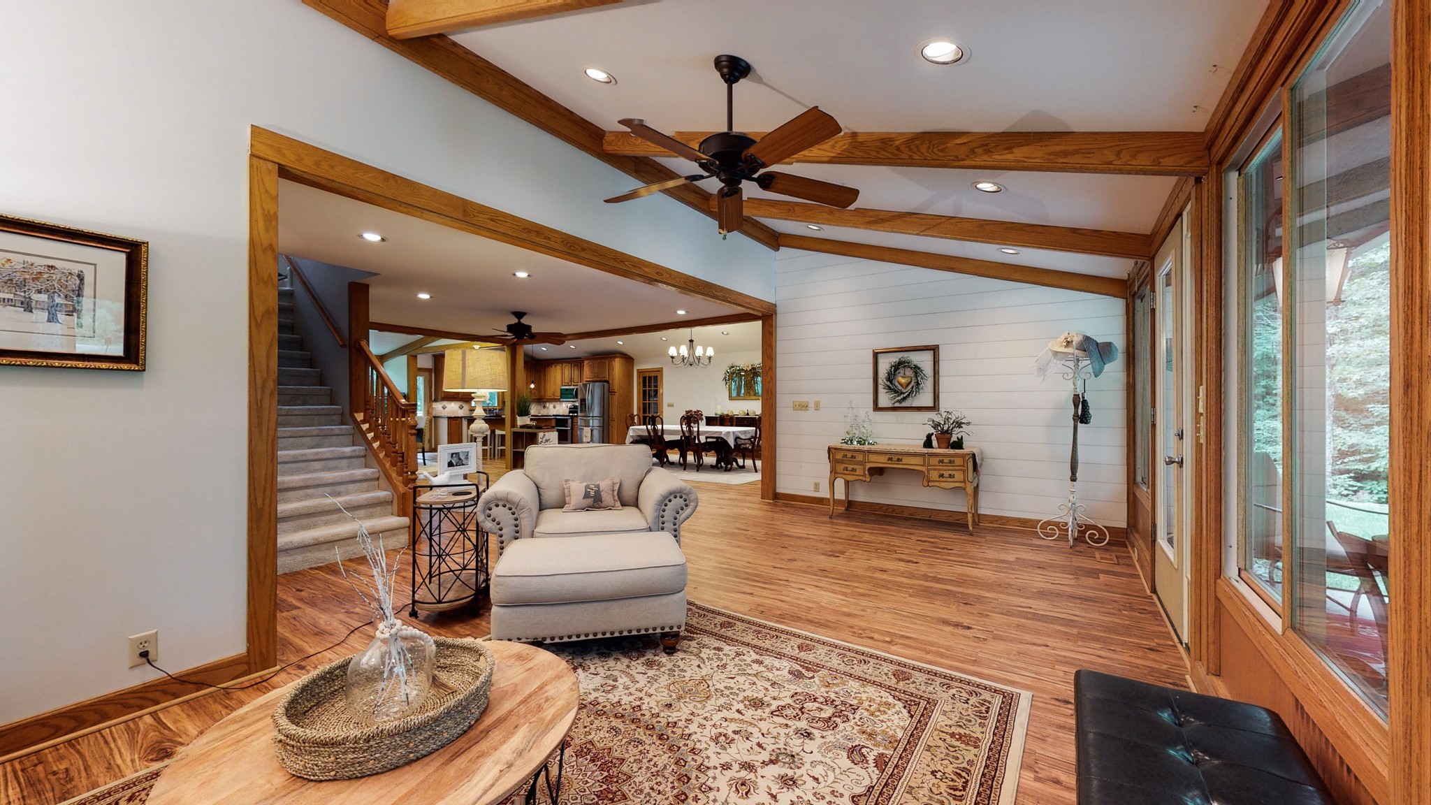7449 Les Hughes Road Fairview, TN 37062 - Photo 2 of 49 a living room with furniture and a chandelier