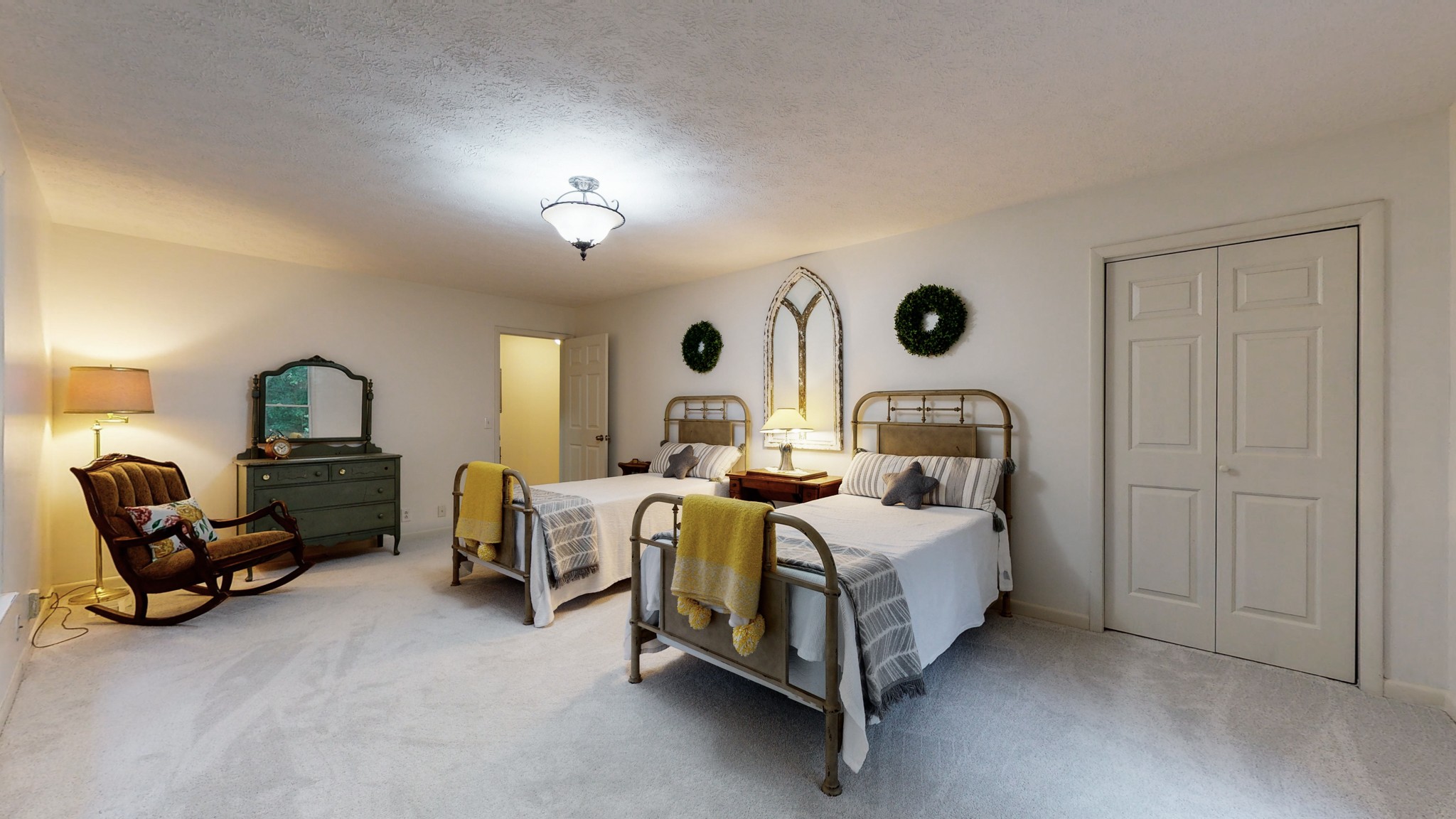 7449 Les Hughes Road Fairview, TN 37062 - Photo 21 of 49 a bedroom with bed mirror and lamp