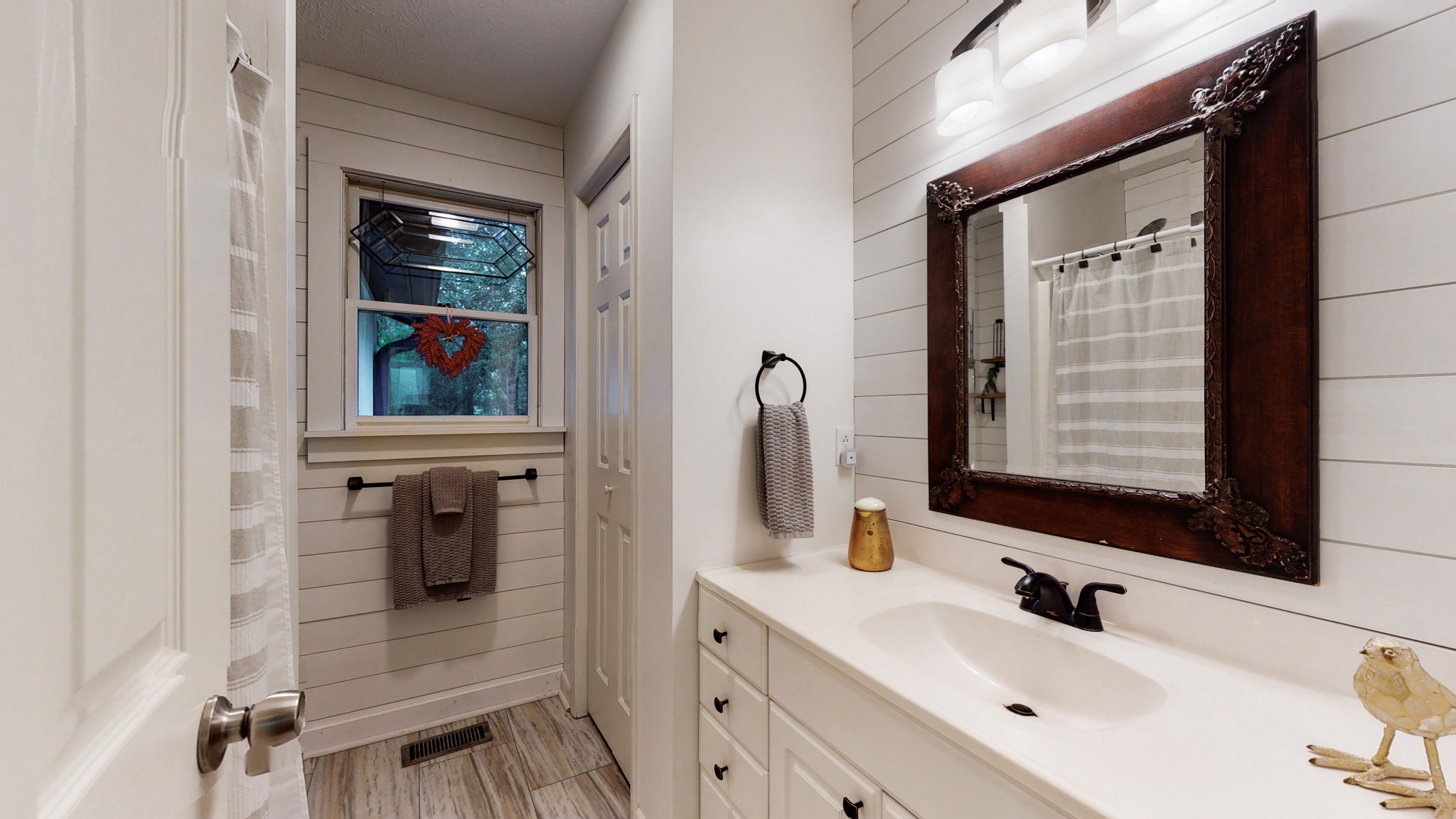 7449 Les Hughes Road Fairview, TN 37062 - Photo 22 of 49 a bathroom with a sink and a mirror