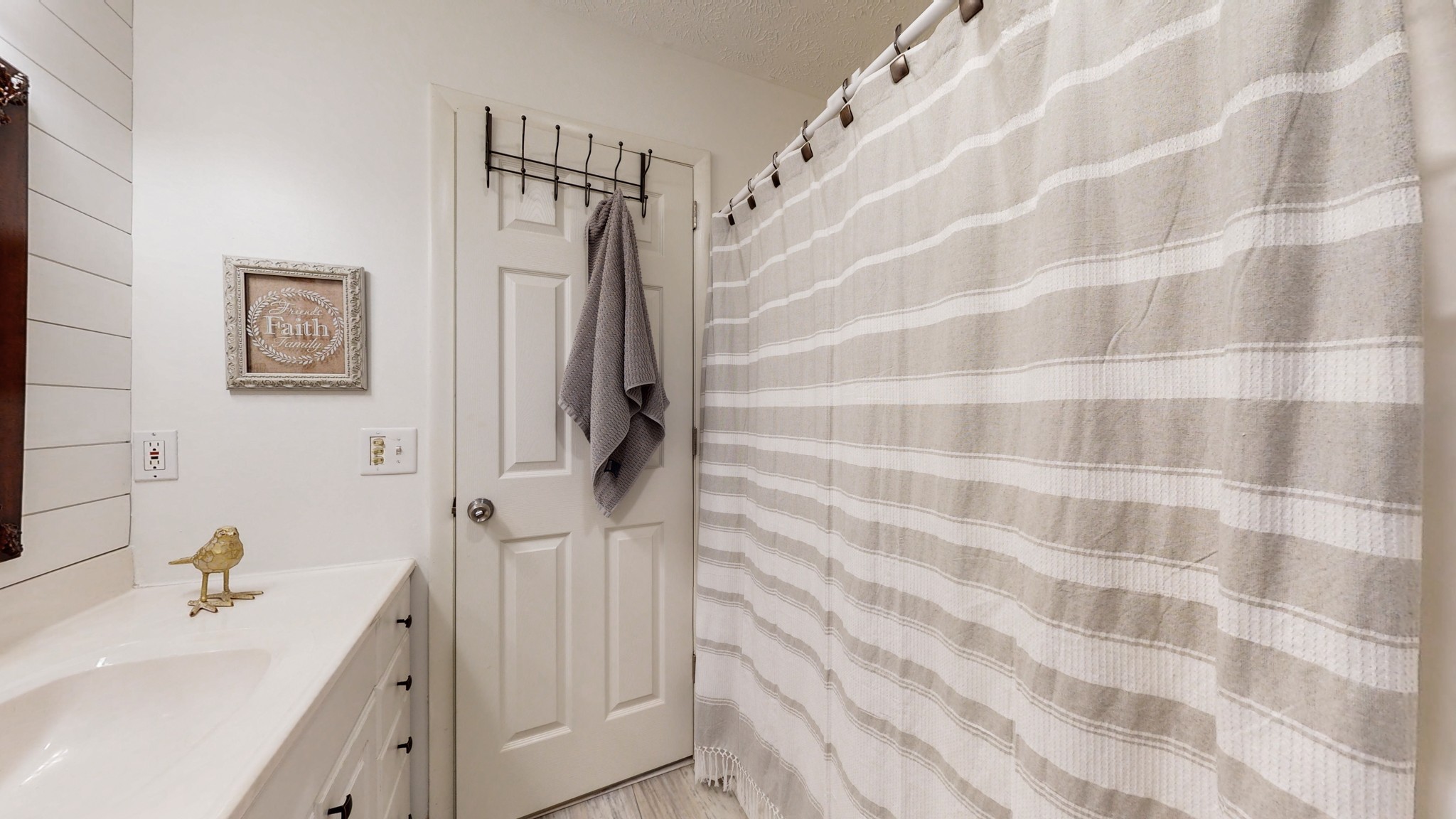 7449 Les Hughes Road Fairview, TN 37062 - Photo 23 of 49 a bathroom with a sink a mirror and a shower