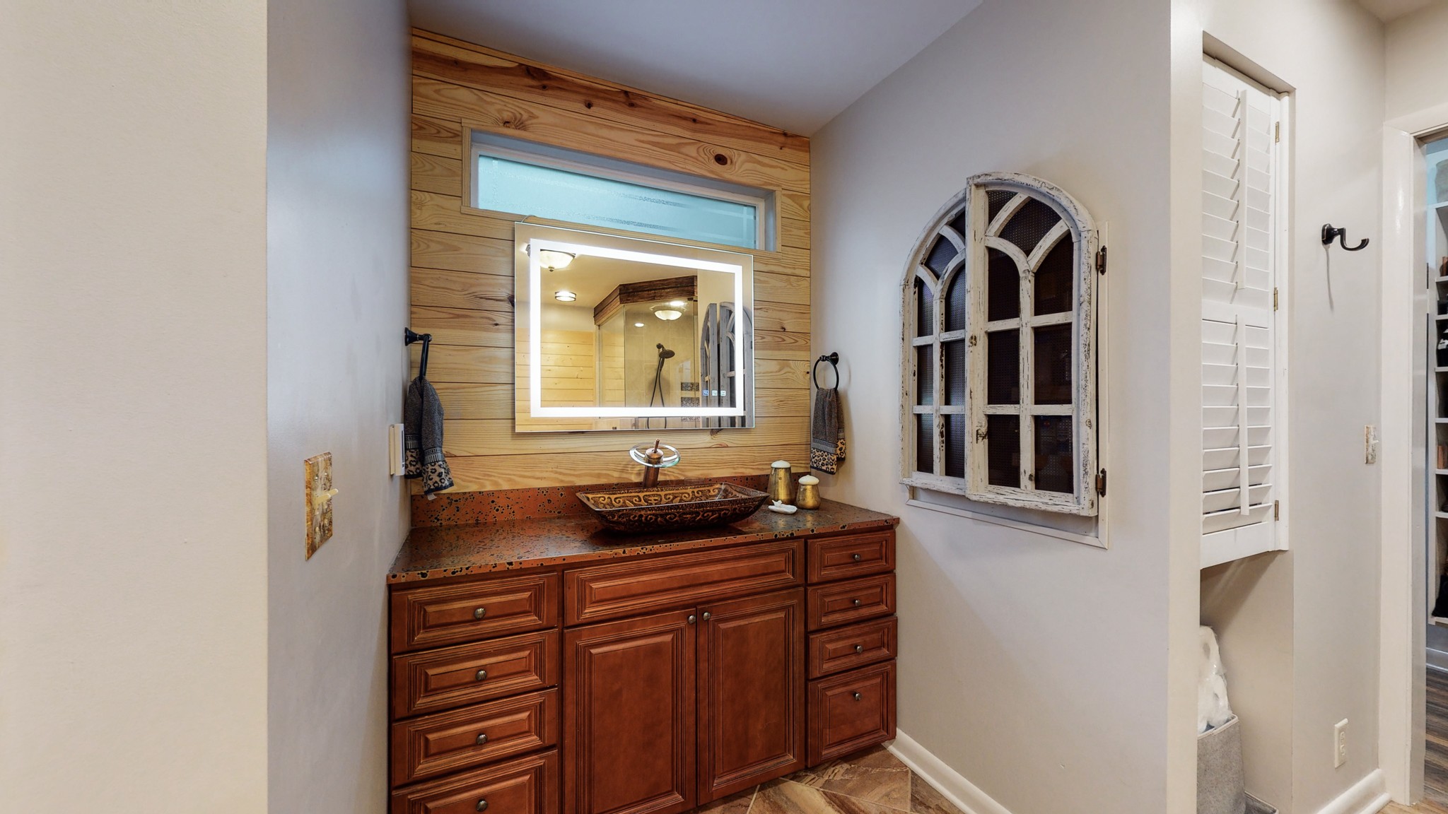 7449 Les Hughes Road Fairview, TN 37062 - Photo 30 of 49 a bathroom with mirror and sink