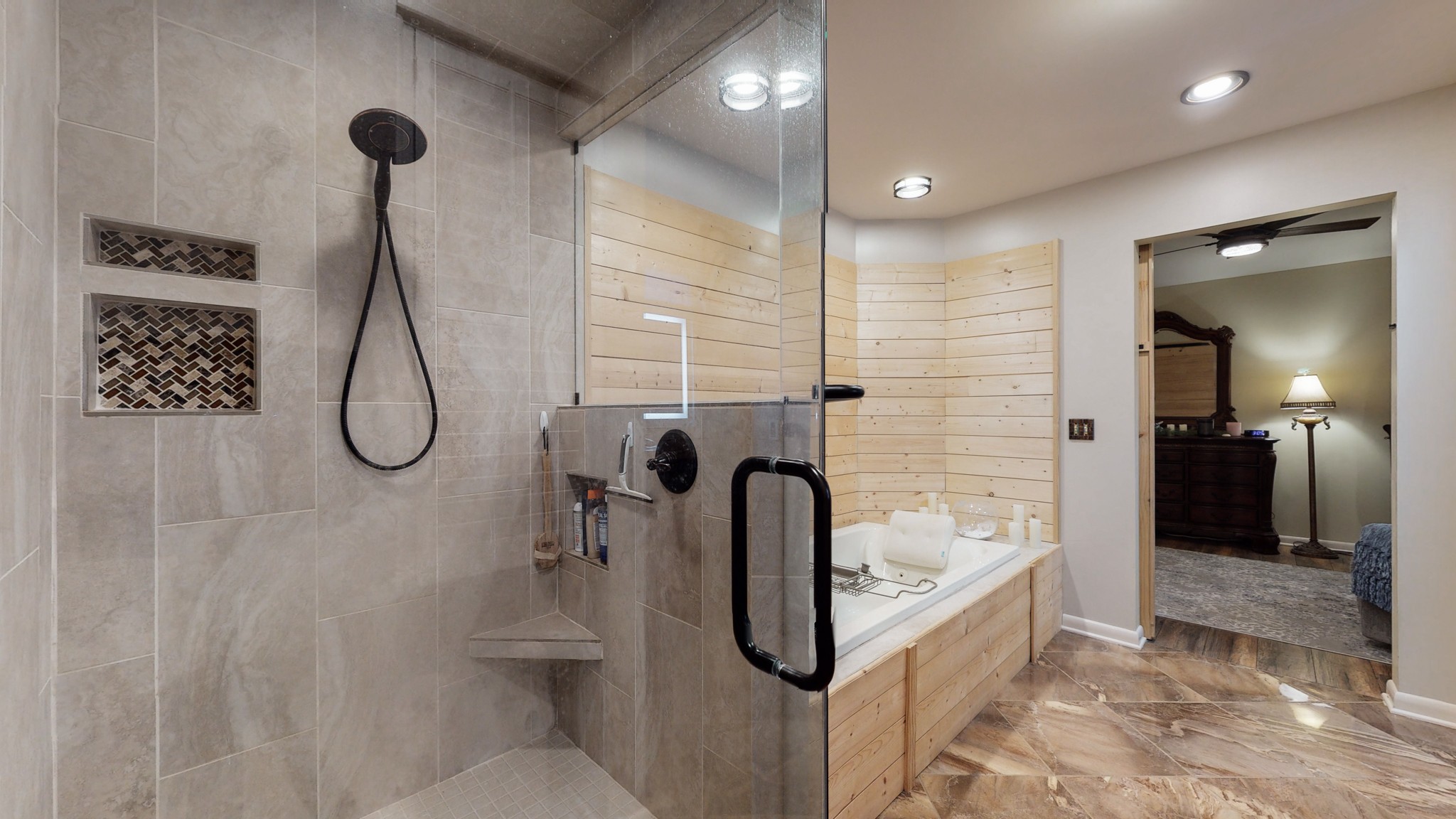 7449 Les Hughes Road Fairview, TN 37062 - Photo 32 of 49 a bathroom with a tub shower and mirror