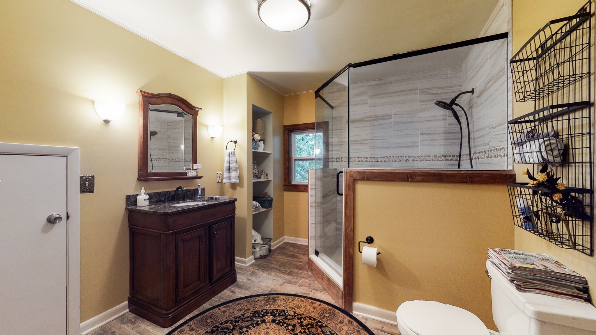 7449 Les Hughes Road Fairview, TN 37062 - Photo 35 of 49 a bathroom with a granite countertop sink mirror vanity and toilet