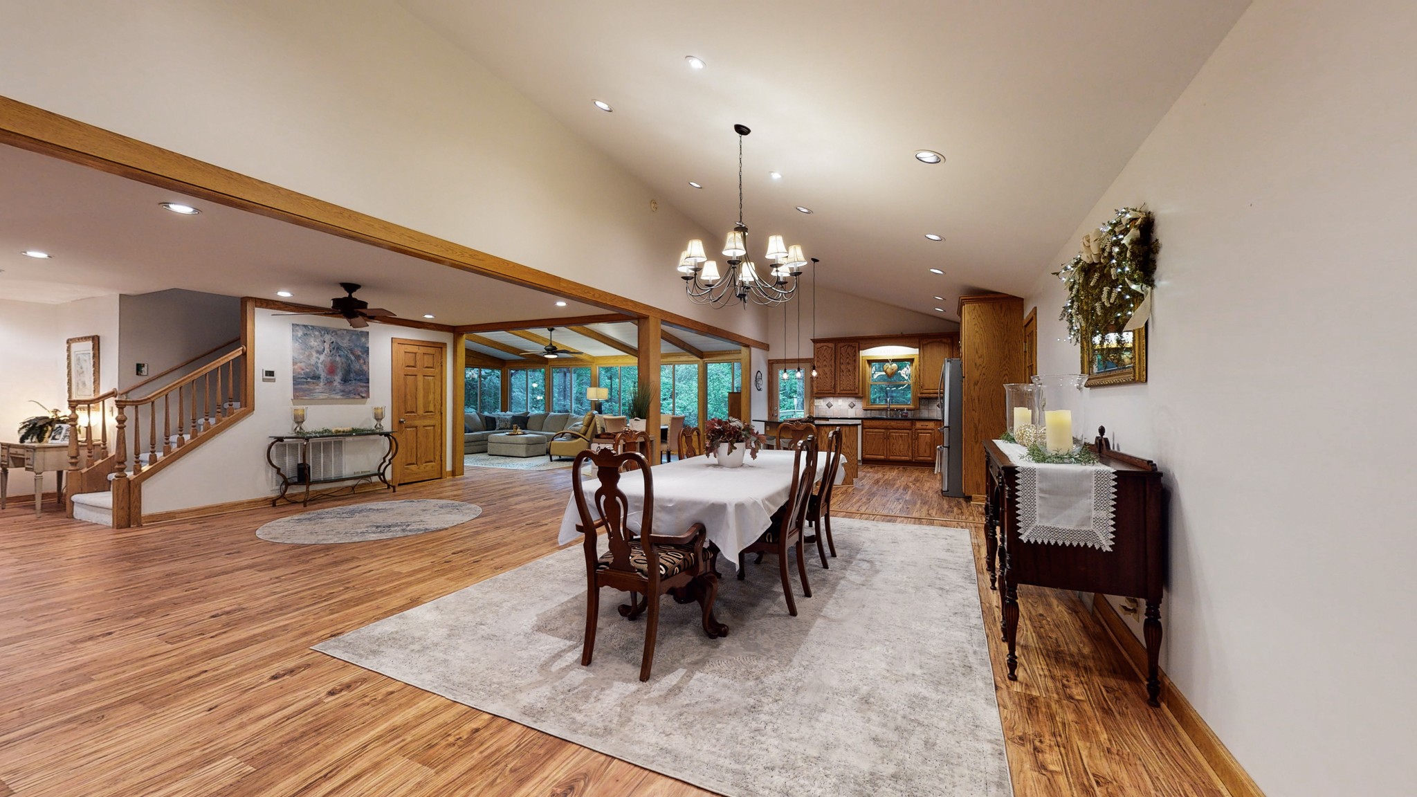 7449 Les Hughes Road Fairview, TN 37062 - Photo 8 of 49 a dining room with furniture a rug and wooden floor