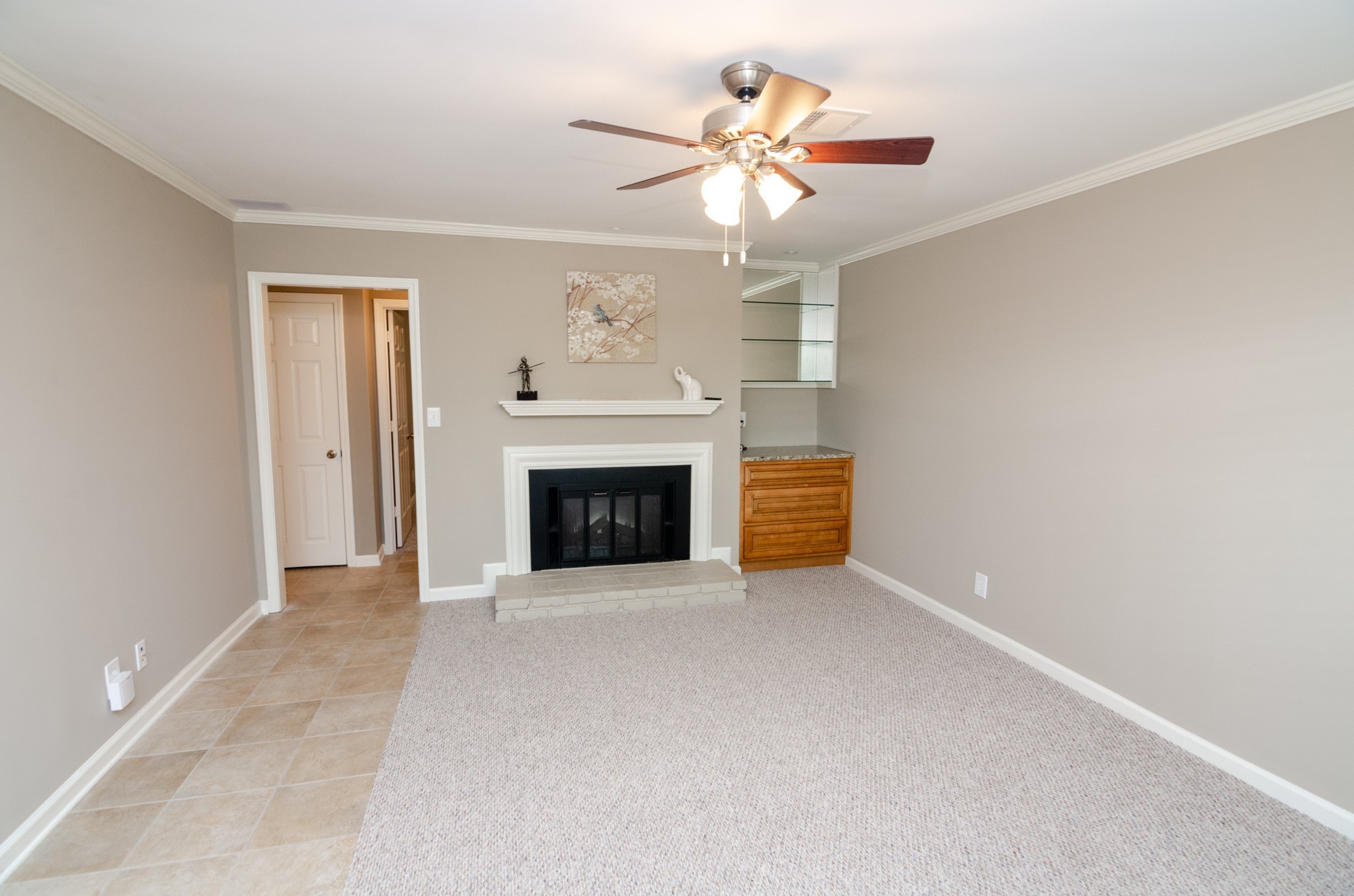 1128 General George Patton Road Nashville, TN 37221 - Photo 2 of 33 an empty room with fireplace and fan
