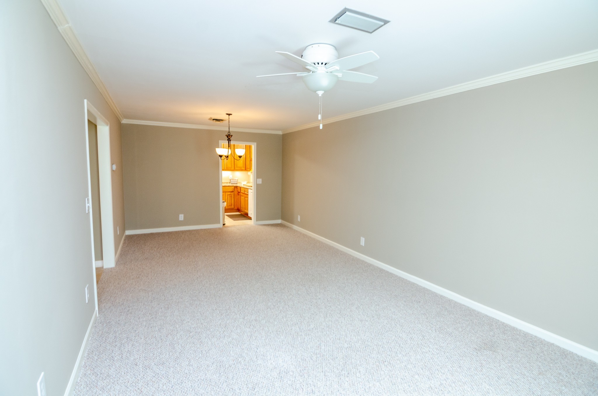 1128 General George Patton Road Nashville, TN 37221 - Photo 14 of 33 an empty room with chandelier fan and windows