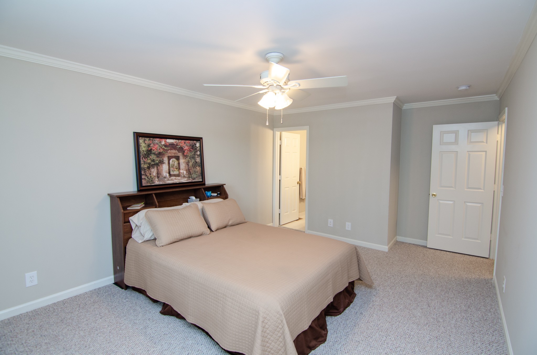 1128 General George Patton Road Nashville, TN 37221 - Photo 16 of 33 a bedroom with a bed and a chandelier
