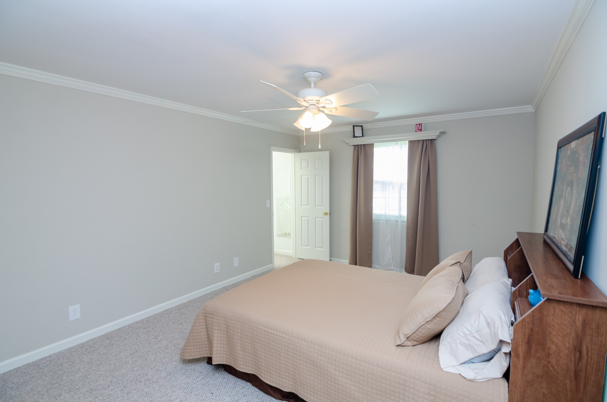 1128 General George Patton Road Nashville, TN 37221 - Photo 17 of 33 a bedroom with a bed and a flat tv screen on a dresser