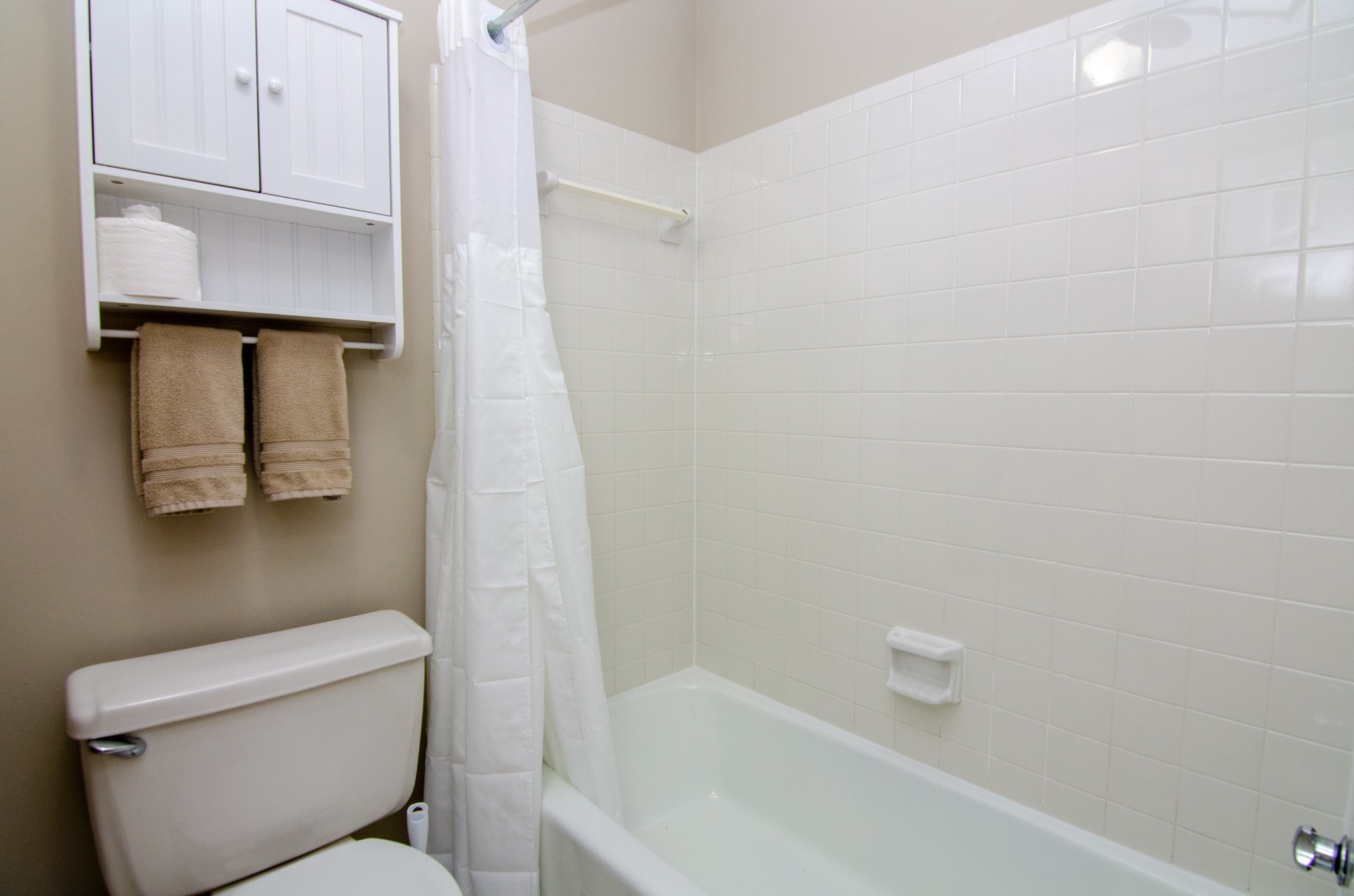 1128 General George Patton Road Nashville, TN 37221 - Photo 28 of 33 a white toilet sitting next to a bath tub