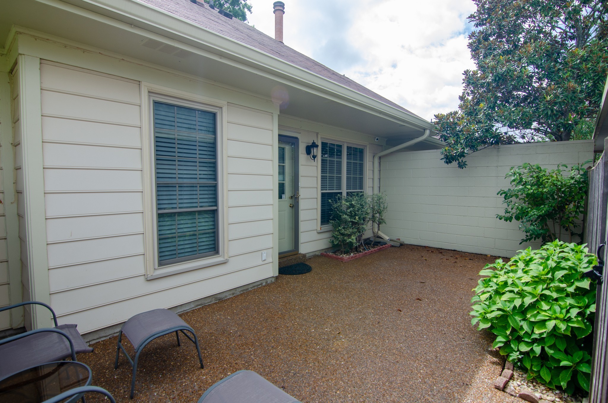 1128 General George Patton Road Nashville, TN 37221 - Photo 30 of 33 a view of a house with a chairs in patio