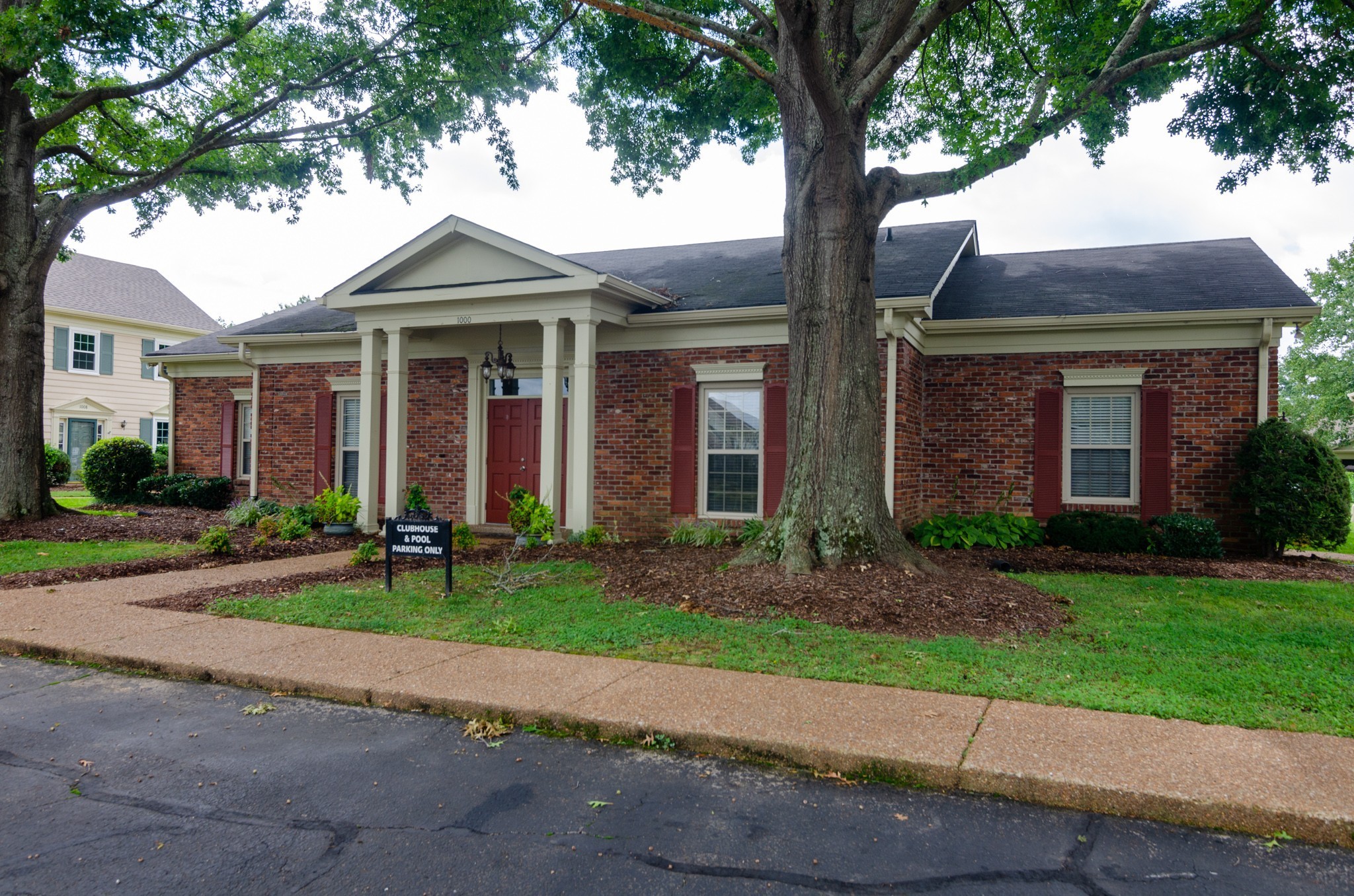 1128 General George Patton Road Nashville, TN 37221 - Photo 32 of 33 a front view of a house with garden and plants