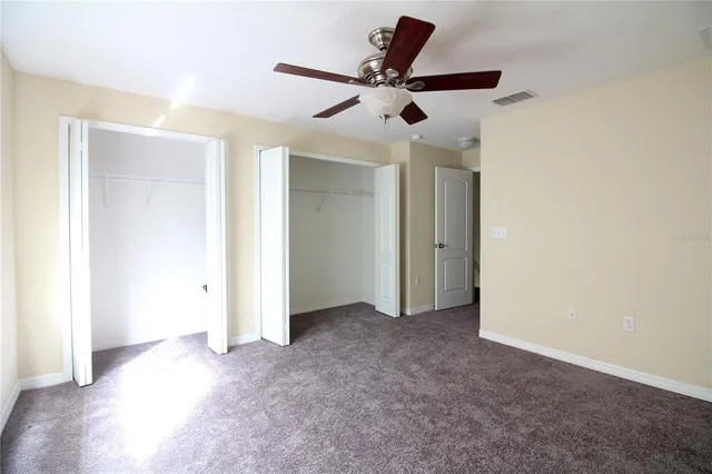 a view of a livingroom with a ceiling fan