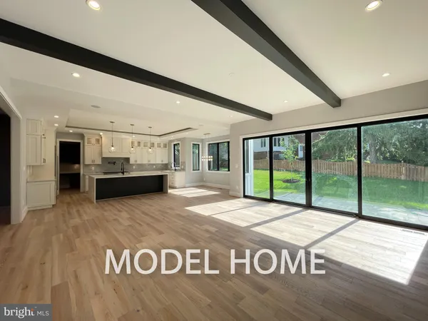 a view of kitchen with stainless steel appliances granite countertop a stove and a refrigerator