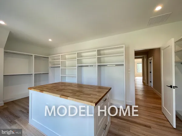 a view of a livingroom with furniture wooden floor and window
