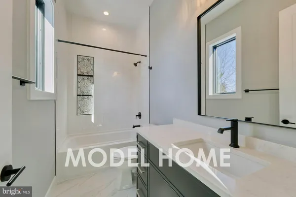 a bathroom with a tub and a shower