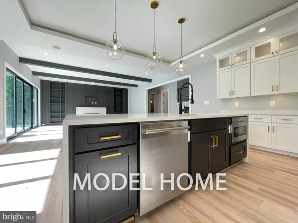 a kitchen with a sink a stove and cabinets