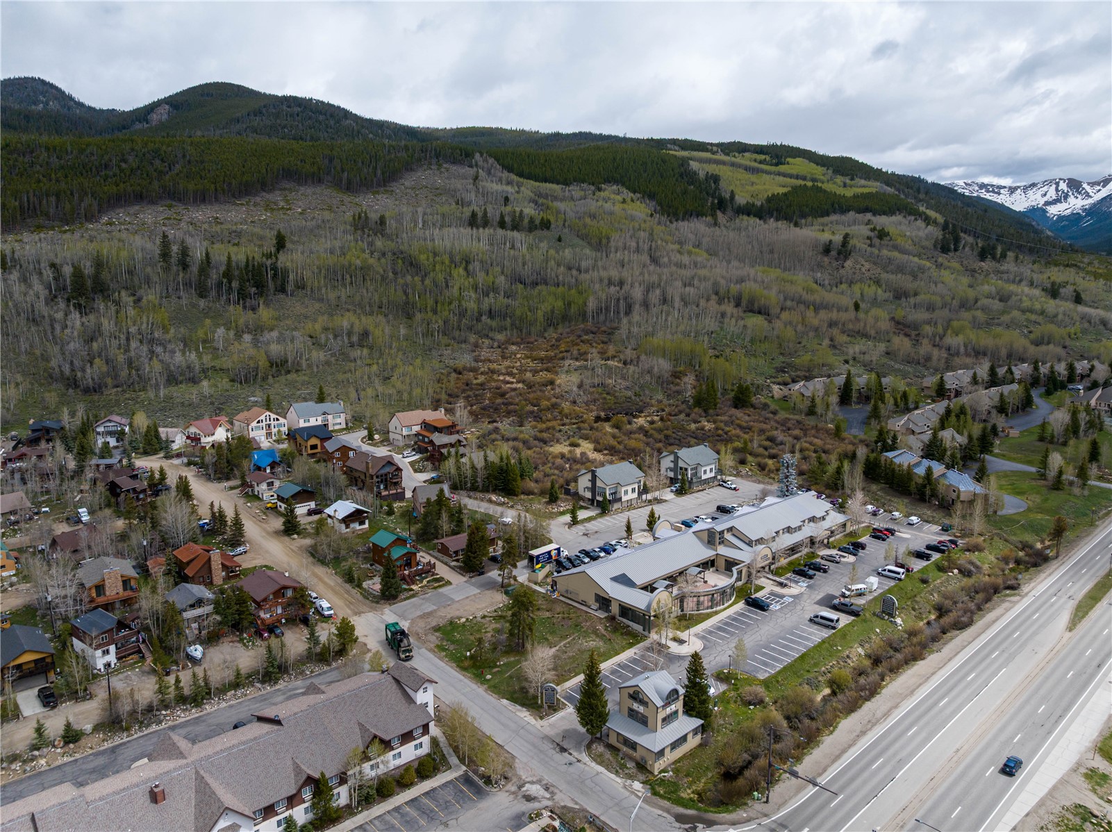 57 Rasor Drive Keystone, CO 80435 - Photo 14 of 22 Aerial overview of property's location with a mountain backdrop, a heavily wooded area, and nearby suburban area