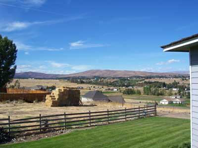 1502 Stein Road Yakima, WA 98908 - Photo 9 of 10 a view of a lake with houses in the background