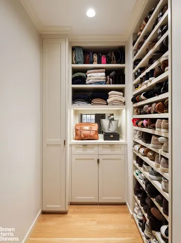 a bedroom with a bed a couch and dresser