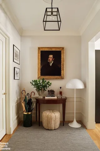 a room with furniture and potted plants