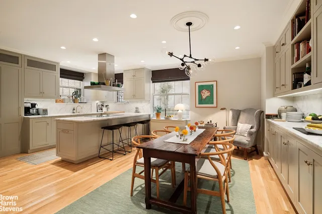 a living room with furniture and a book shelf