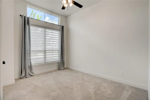 a spacious bathroom with a double vanity sink mirror and bathtub