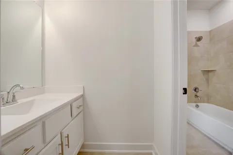 a bathroom with a sink and a bathtub