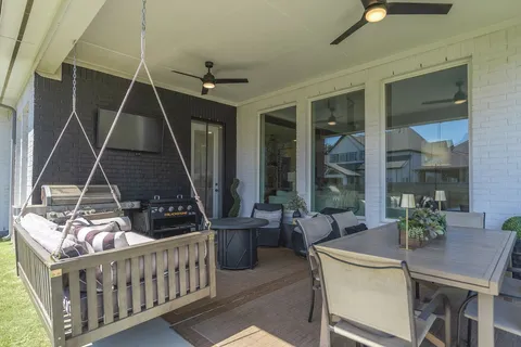 a living room with furniture and stairs