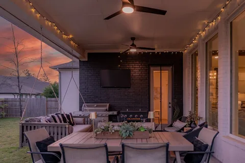 a outdoor living space with furniture and a fireplace
