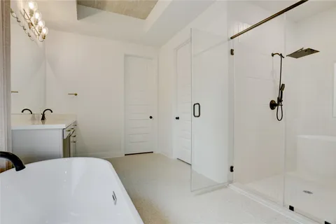 a bathroom with a sink and shower