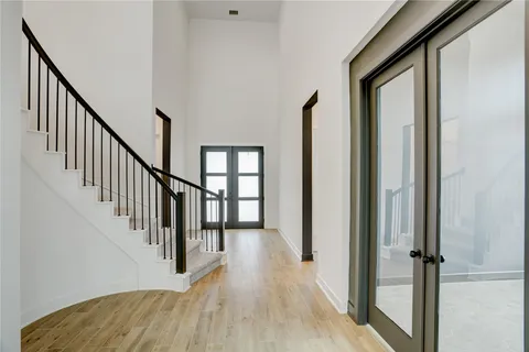 a view of an entryway with wooden floor