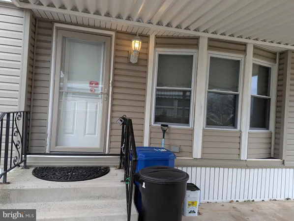 a table and chairs in front of a house
