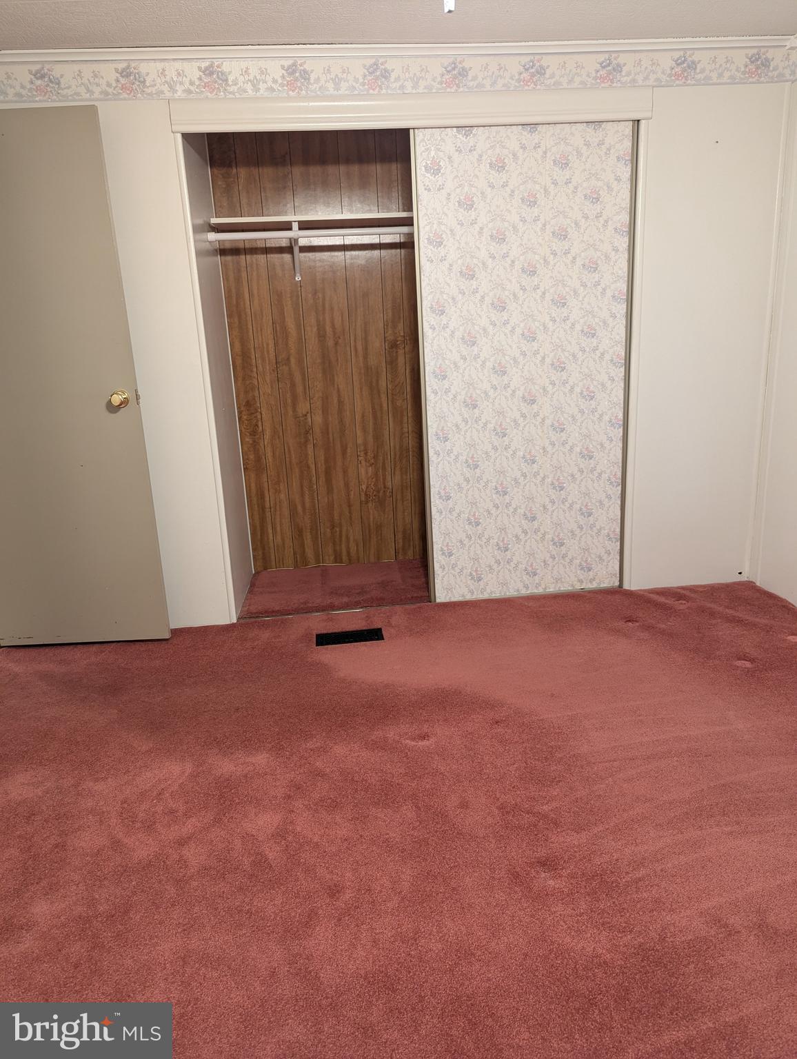 220 Winding Brook Run North Wales, PA 19454 - Photo 23 of 38 an empty room with wooden floor and mirror