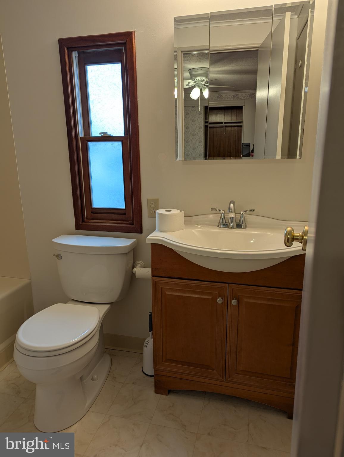 220 Winding Brook Run North Wales, PA 19454 - Photo 24 of 38 a bathroom with a toilet sink and mirror