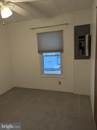 a room with gym equipment and a large window