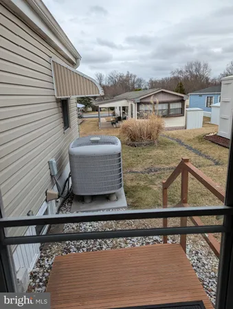 a view of a house with backyard and porch