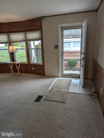 a bed room with a bed and a chair