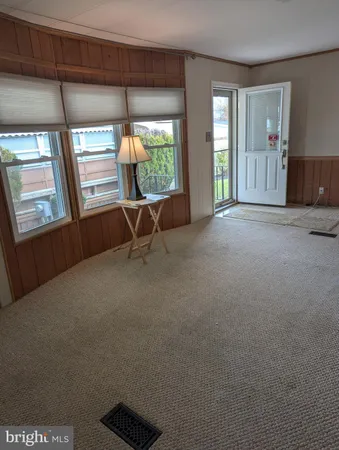 a view of livingroom with furniture and window