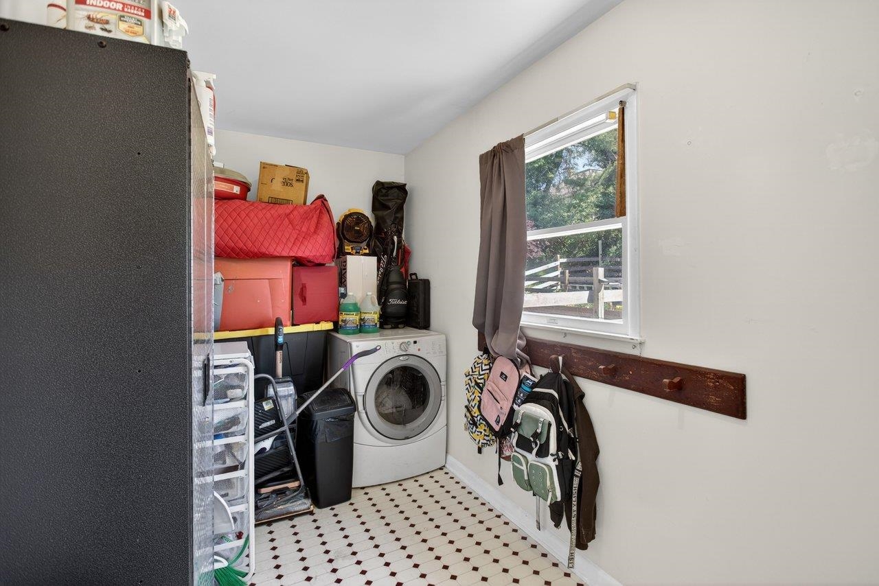 420 West Spring Street Woodstock, VA 22664 - Photo 27 of 67 a utility room with sink dryer and washer