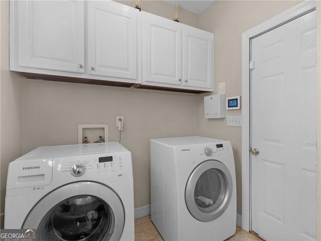 355 Parker Road Covington, GA 30014 - Photo 16 of 60 a utility room with dryer and washer