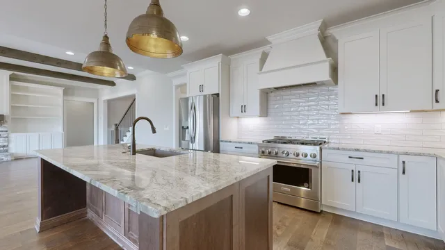 a white stove top oven sitting inside of a kitchen