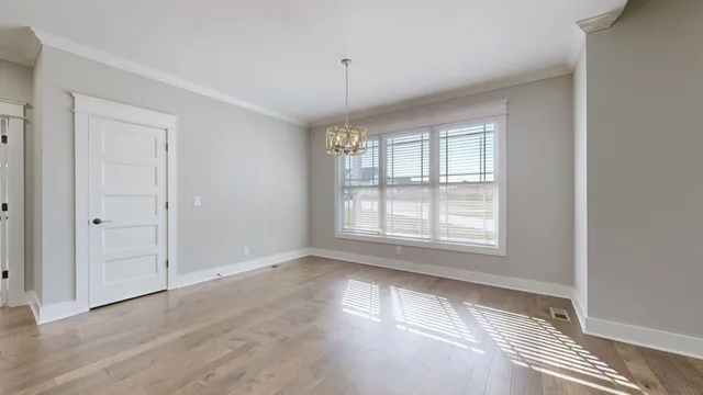 a bedroom with a bed and cabinet