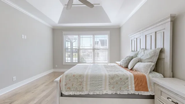 a bathroom with a granite countertop double vanity sink and a mirror