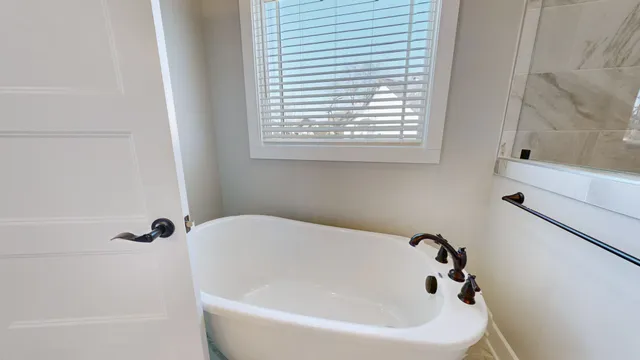 an empty room with a ceiling fan and windows